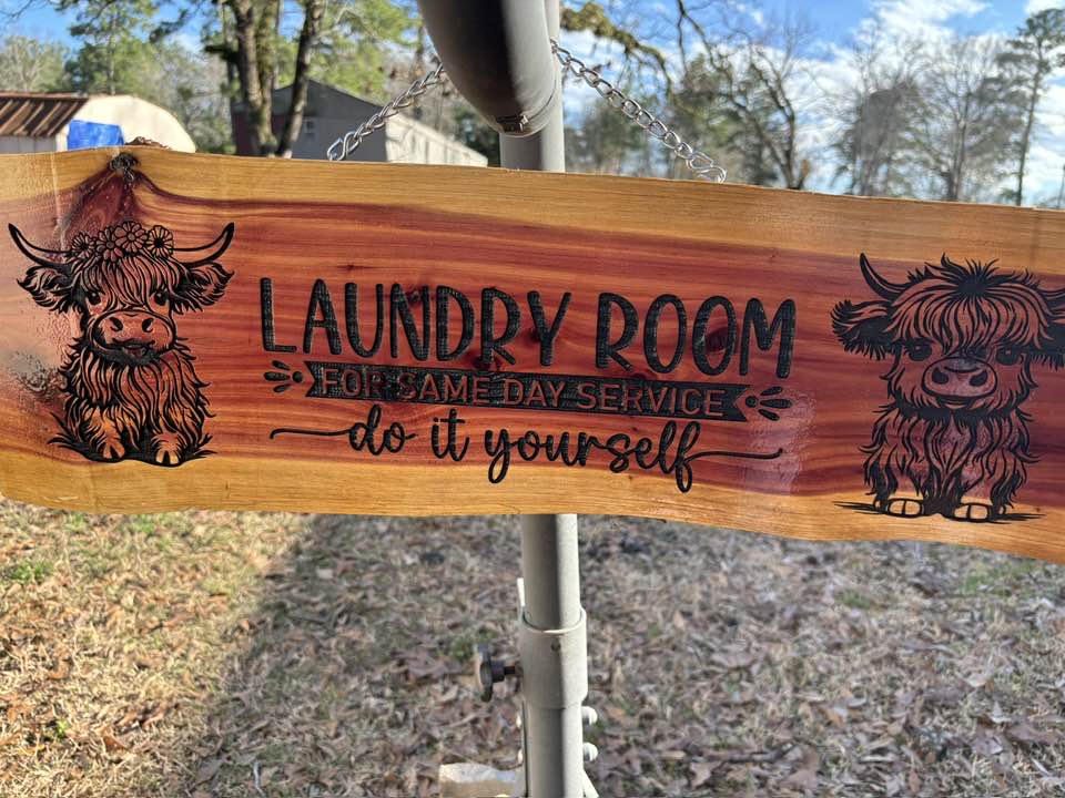 Highland Cow Laundry Service sign